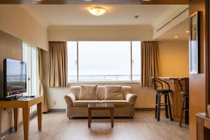 Deluxe Double Room, Ocean View | Living area | Flat-screen TV