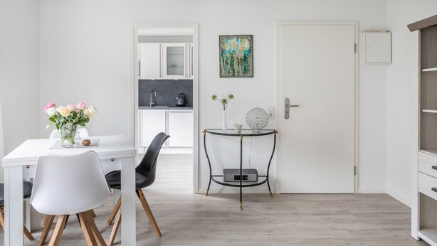 A modern kitchen with white cabinets, a grey countertop, and a coffee machine. - Pet-Friendly Apartment Holly with Wi-Fi & Terrace (Ebringen)