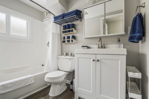 Combined shower/bathtub, hair dryer, towels, soap