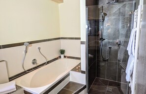 Bathtub, hair dryer, towels