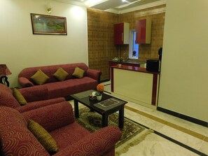 Deluxe Room | Living area - Triple One Hotel Suites (Abbottabad)