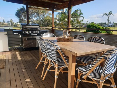 Indoor/outdoor pet-friendly beach house next to world-class beach and river.