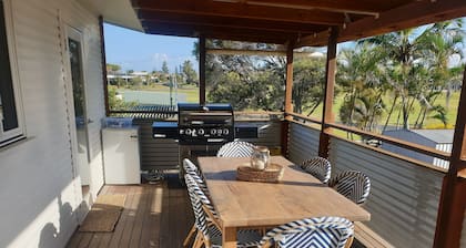 Indoor/outdoor pet-friendly beach house next to world-class beach and river.