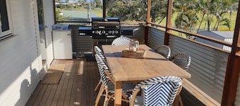 Indoor/outdoor pet-friendly beach house next to world-class beach and river.