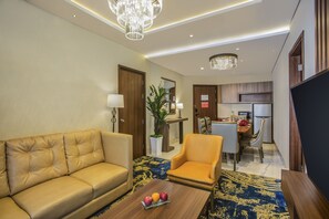 Executive Double Room | Living area | 50-inch LED TV with cable channels, TV, Netflix