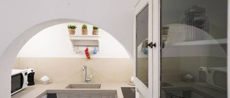 Fridge, microwave, stovetop, coffee/tea maker