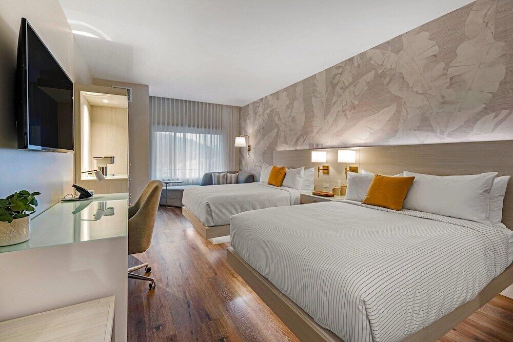 Premium bedding, desk, laptop workspace, iron/ironing board