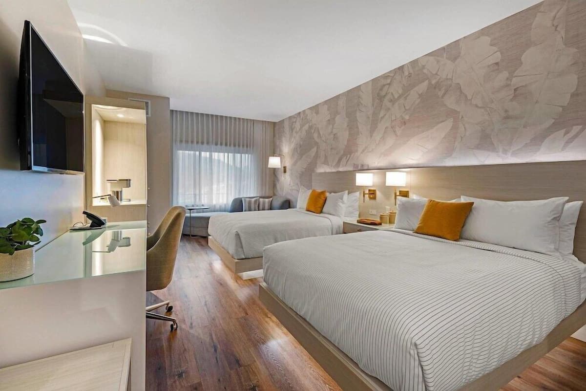Premium bedding, desk, laptop workspace, iron/ironing board
