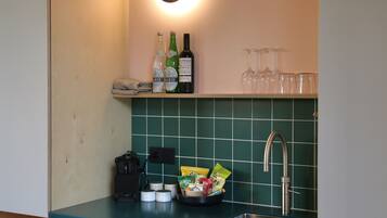 Deluxe Cabin | Private kitchen | Full-size fridge, coffee/tea maker, highchair