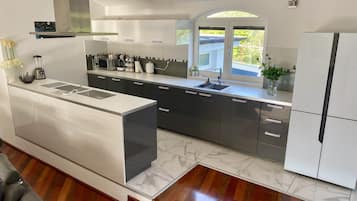 Villa | Private kitchen | Fridge, microwave, oven, stovetop