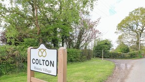 A sign for Colton Historic Village. - Shepherds Hut (Rugeley)