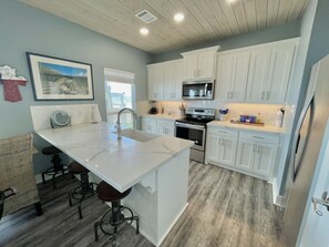 Coffee/tea maker, fridge, microwave, dishwasher