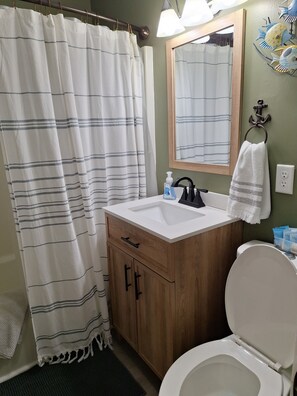 Combined shower/tub, hair dryer, towels, soap