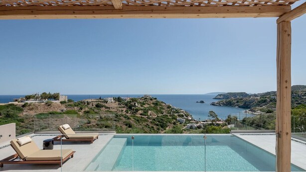 A rooftop pool with clear blue water, surrounded by lounge chairs and a pergola, overlooking a coastal landscape. - Sea View Villa w/ Private Pool & BBQ (Heraklion, Crete)