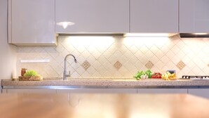 Departamento Deluxe, 4 habitaciones | Cocina privada