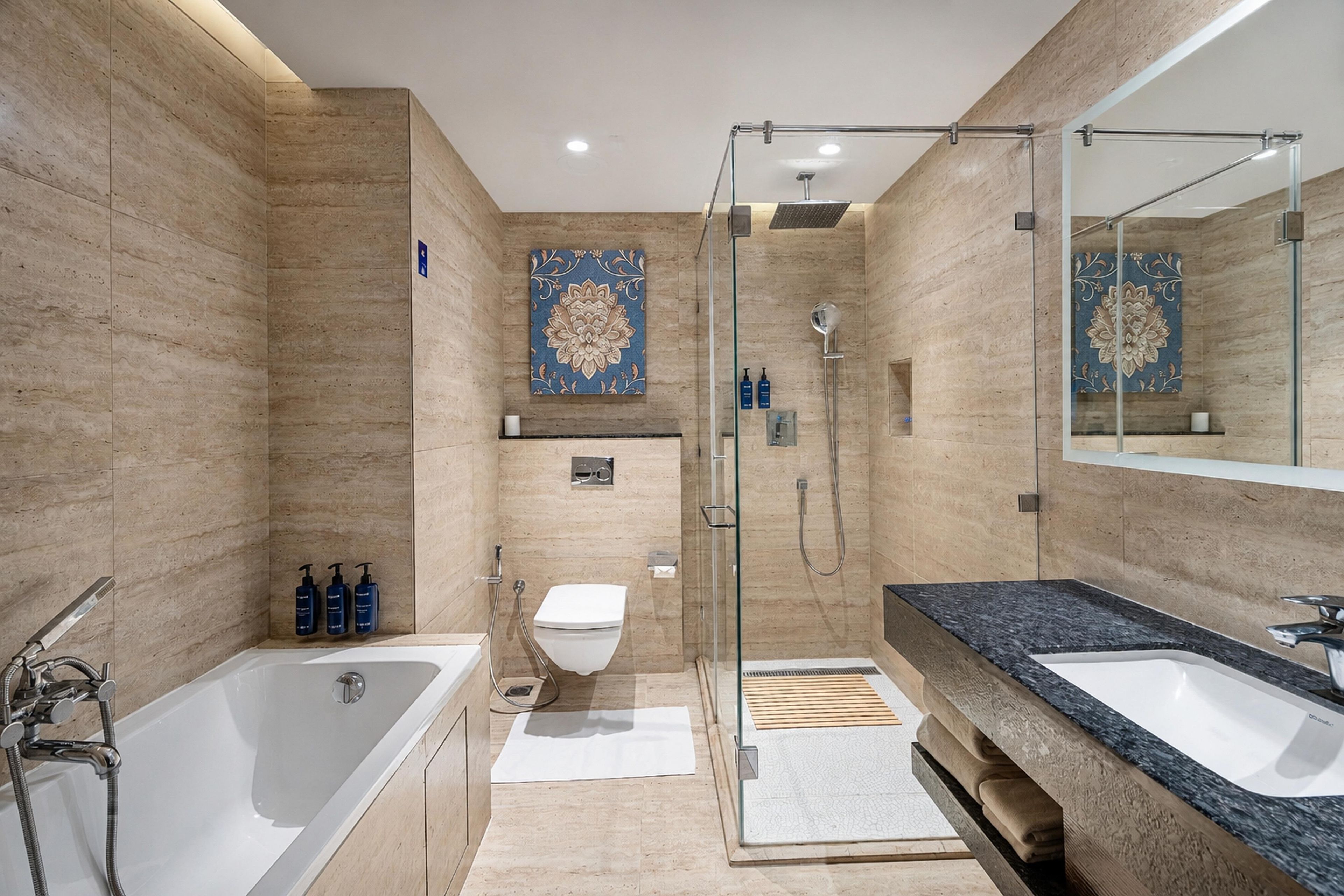 A modern bathroom with a bathtub, a shower, and a vanity with a large mirror.