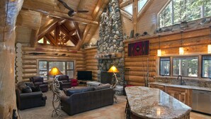 A log cabin interior with a stone fireplace, a stone wall, a fireplace mantel, a stone wall, a stone fireplace, a stone wall, a stone fireplace, a stone wall, a stone fireplace, a stone wall, a stone fireplace, a stone wall, a stone fireplace, a stone wall, a stone fireplace, a stone wall, a stone fireplace, a stone wall, a stone fireplace, a stone wall, a stone fireplace, a stone wall, a stone fireplace, a stone wall, a stone fireplace, a stone wall, a stone fireplace, a stone wall, a stone fireplace, a stone wall, a stone fireplace, a stone wall, a stone fireplace, a stone wall, a stone fireplace, a stone wall, a stone fireplace, a stone wall, a stone fireplace, a stone wall, a stone fireplace, a stone wall, a stone fireplace, a stone wall, a stone fireplace, a stone wall, a stone fireplace, a stone wall, - (67) El Capitan (3 Bedrooms Only) at The Redwoods In Yosemite (Yosemite National Park)