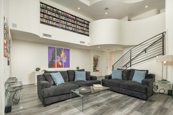 Cozy Living Room Area. Plush, Couch w/ Love Seat. Contemporary Art And Decor.