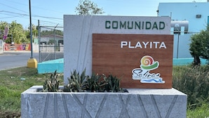 A sign for 'Playita' in 'Salinas, Capital del Mar Caribe'.