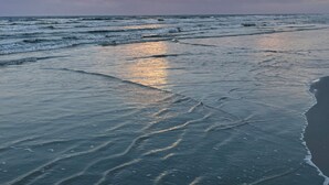 A beach with waves and a clear sky. - Ocean-View 2BR Retreat Steps to Crescent Beach - Pet-Friendly (St. Augustine)