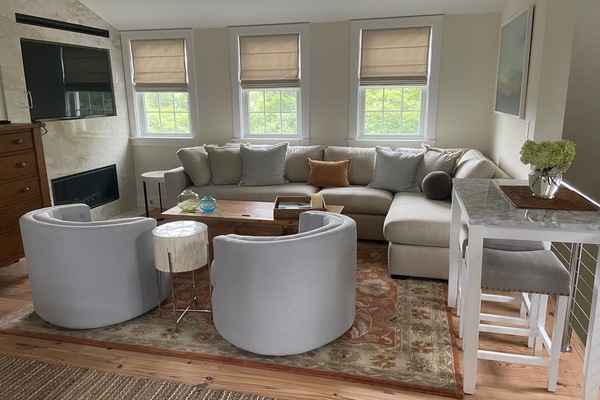 Living room area with 52” flat screen TV and fireplace