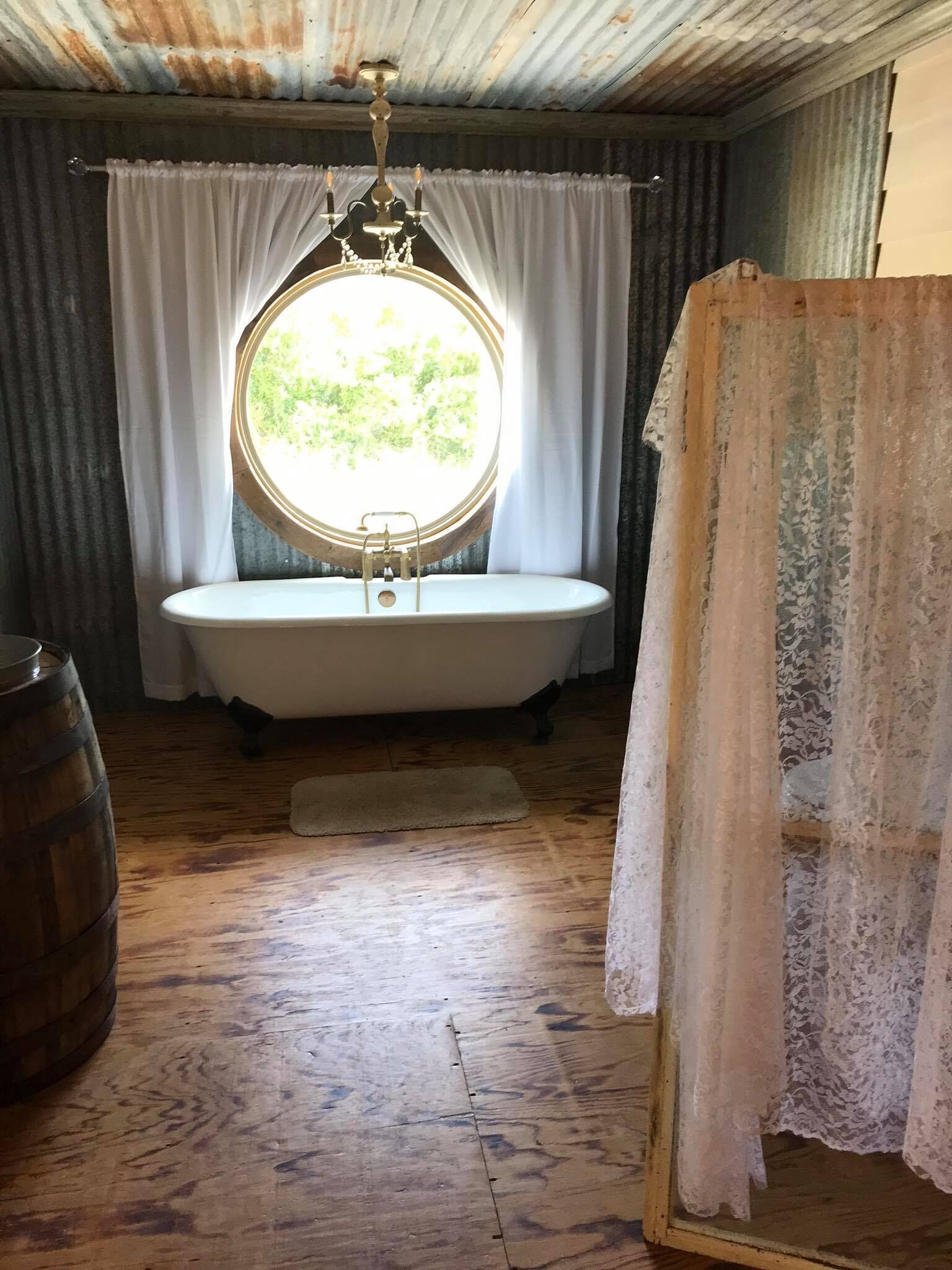 Bathtub, towels, soap, toilet paper
