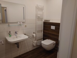 Shower, towels, soap, toilet paper