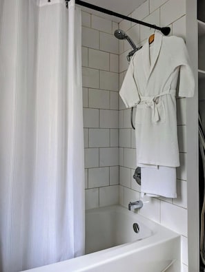 Combined shower/tub, hair dryer, towels, soap