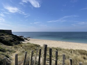 On the beach, sun-loungers