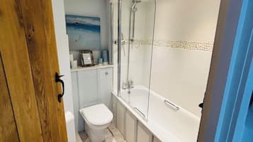 Combined shower/bathtub, towels, soap