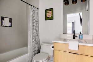 Bathtub, hair dryer, towels