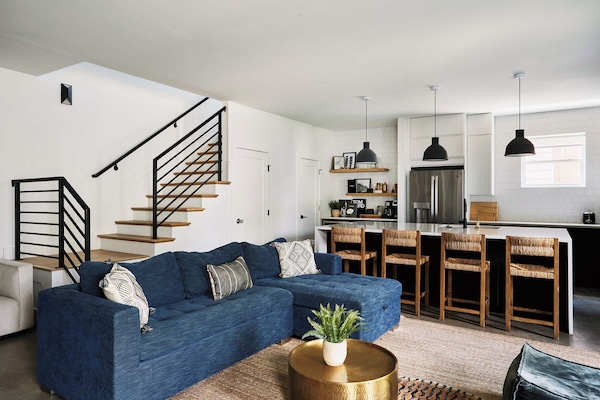 Step into comfort, this inviting living room features a plush sofa that easily converts into a sleeper for extra guests.