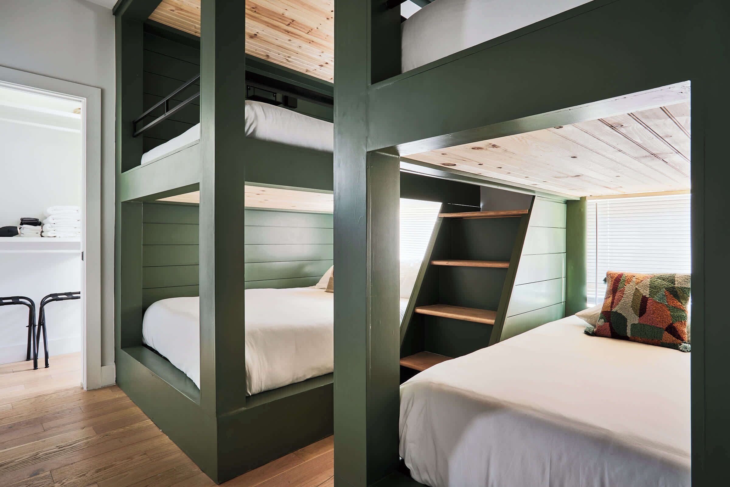Our chic built-in bunk beds provide a modern flair and ample space for everyone. Featuring both a queen and twin bunk, they are designed to maximize space and comfort—ideal for families or groups of friends.