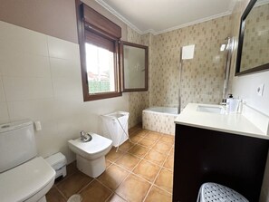 Bathtub, hair dryer, towels