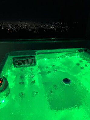 A hot tub with a green light, bubbles, and a vent. - VILLA M WITH PRIVATE POOL,PRIVATE SAUNA & JACUZZI (Lavci)