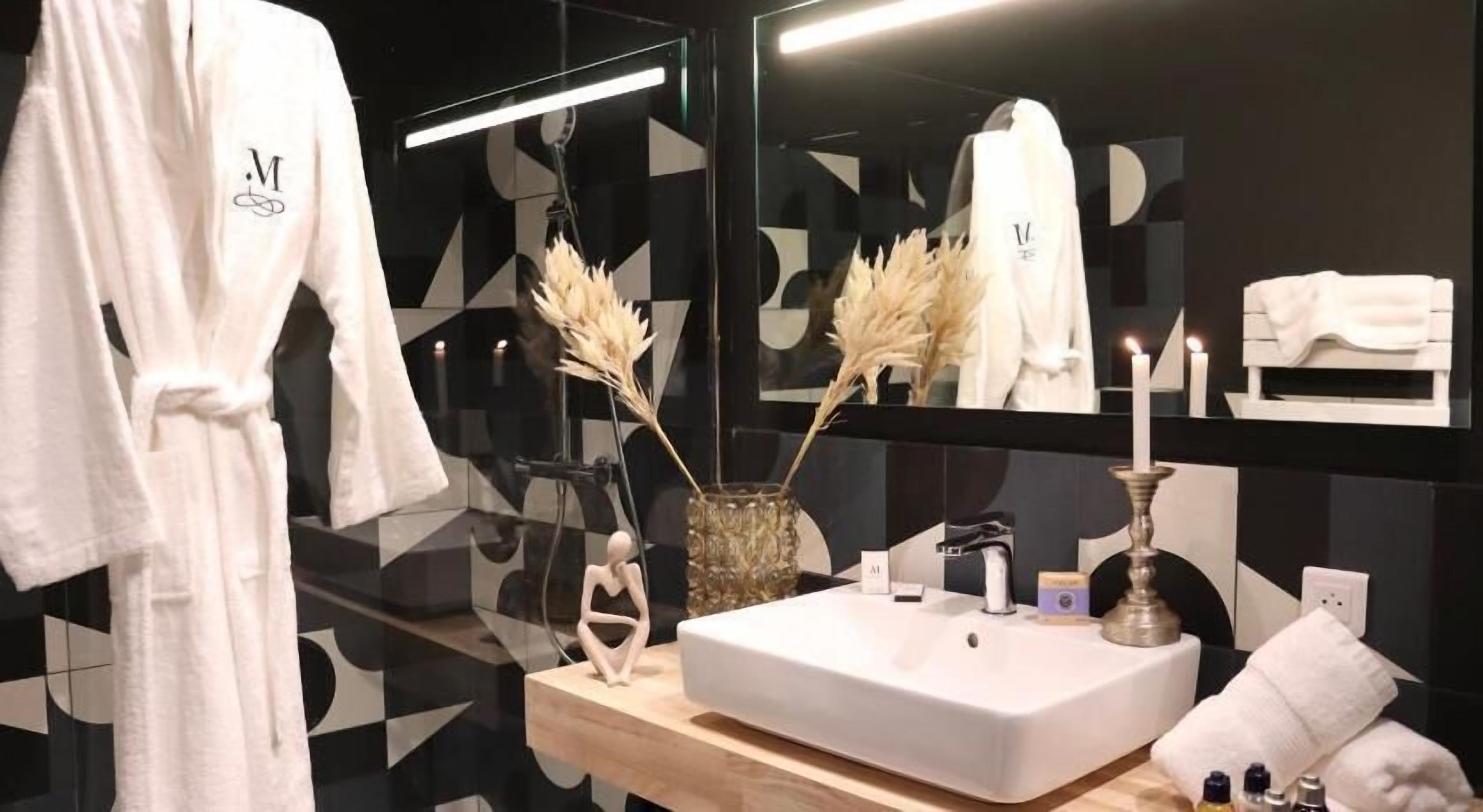 Bathroom | Designer toiletries, hair dryer, bathrobes, slippers