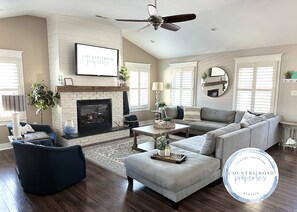 Smart TV, fireplace, books, video library