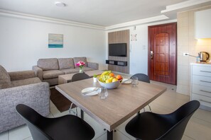 50-inch Smart TV with digital channels, TV, fireplace - Triple A Hotel Apartments (Amman)