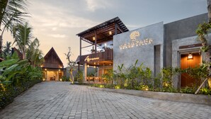 A modern building with a sign reading "AGRAPA BEACH VILLA." - Agrapana Beach Villa (Sukawati)