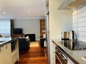 Fridge, microwave, oven, stovetop - Kauri Cottage - Russell Cottage Collection (Russell)