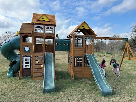 Children's area. Relax & Recharge in Paige, Tx - 15 Acres, Fishing, and Farm Animals Await