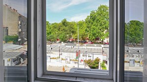 A window with a view of a parking lot and buildings. - A1 - apt in the Very Heart of Split With sea View (Split)