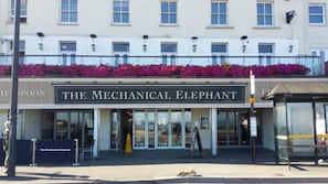 A building with a sign reading "The Mechanical Elephant".