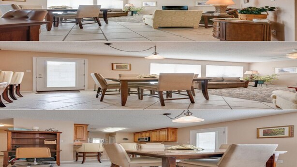 Un comedor con una gran mesa de madera, sillas y un sofá. Hay un televisor y una lámpara sobre un mueble de madera.