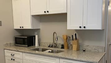 Fridge, oven, coffee/tea maker, cookware/dishes/utensils