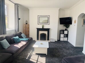 Smart TV, fireplace, DVD player, books