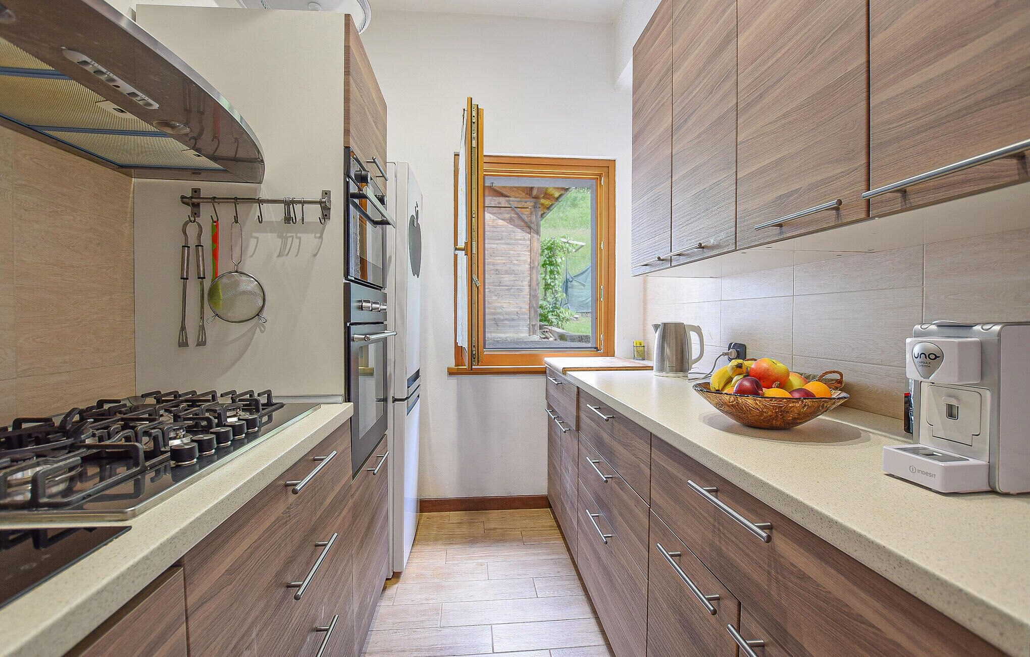 Fridge, stovetop, dishwasher, coffee/tea maker