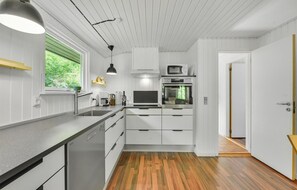 Fridge, stovetop, dishwasher, coffee/tea maker