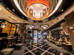 A luxurious lobby with a grand chandelier, marble flooring, and modern furnishings. - APA Hotel Kintetsu Nara Ekimae (Nara)