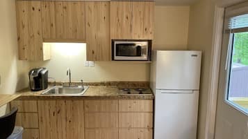 Fridge, dishwasher, coffee/tea maker, cookware/dishes/utensils